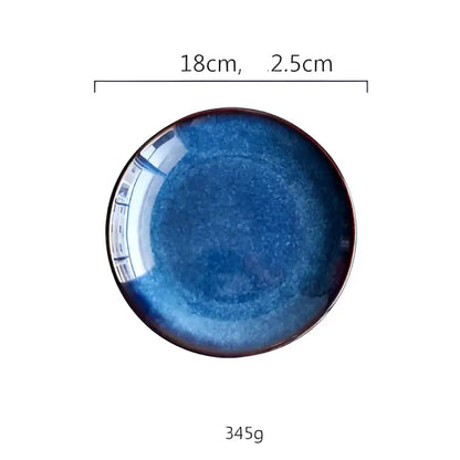 Handcrafted ceramic round plate with deep blue gradient glaze and subtle speckled texture in a set of 3
