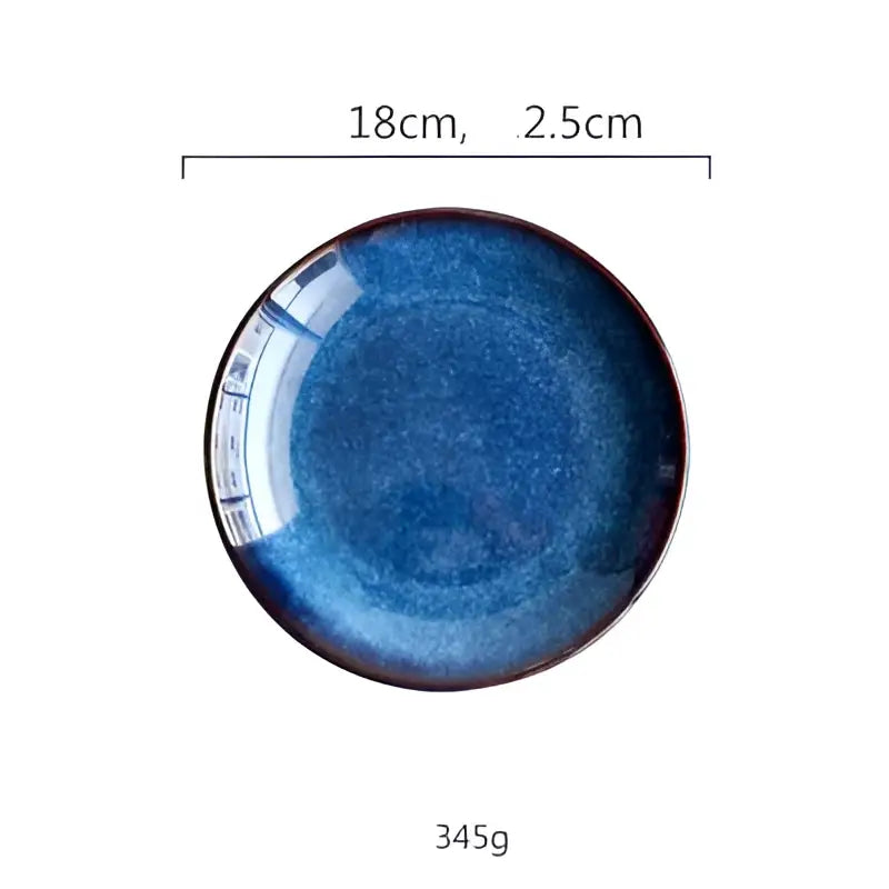 Handcrafted ceramic round plate with deep blue gradient glaze and subtle speckled texture in a set of 3