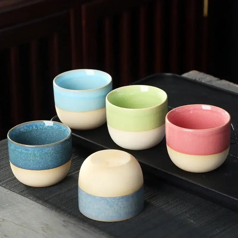 Handcrafted gradient ceramic kung fu tea cup set featuring five pastel two-tone tea cups in soft blue green pink and beige