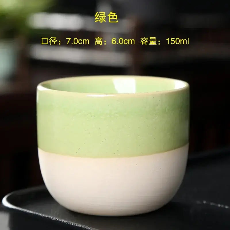 A smooth two-toned handcrafted ceramic kung fu tea cup in mint green and white from decorbites ceramic kung set
