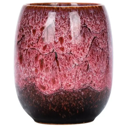 Handcrafted multicolored ceramic tea cup with glossy crackled glaze in burgundy pink and reddish hues for drinkware set