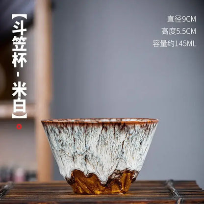 Handcrafted ceramic tea cup set featuring a white and brown textured glaze for dining room drinkware use
