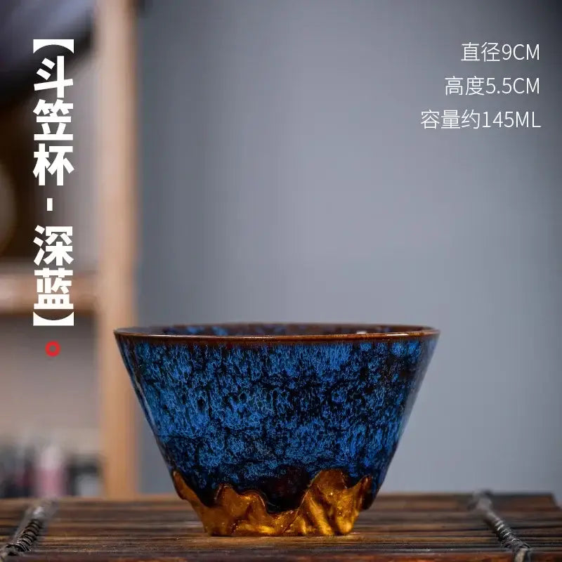 Deep blue ceramic tea cup with golden flame base and textured glaze from handcrafted multicolored cup set