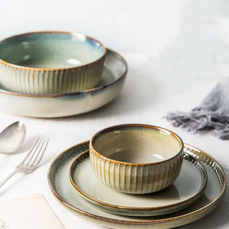 Handcrafted decorbites ceramic dessert plate with vertical ridges in sage green cream and earthy brown tones