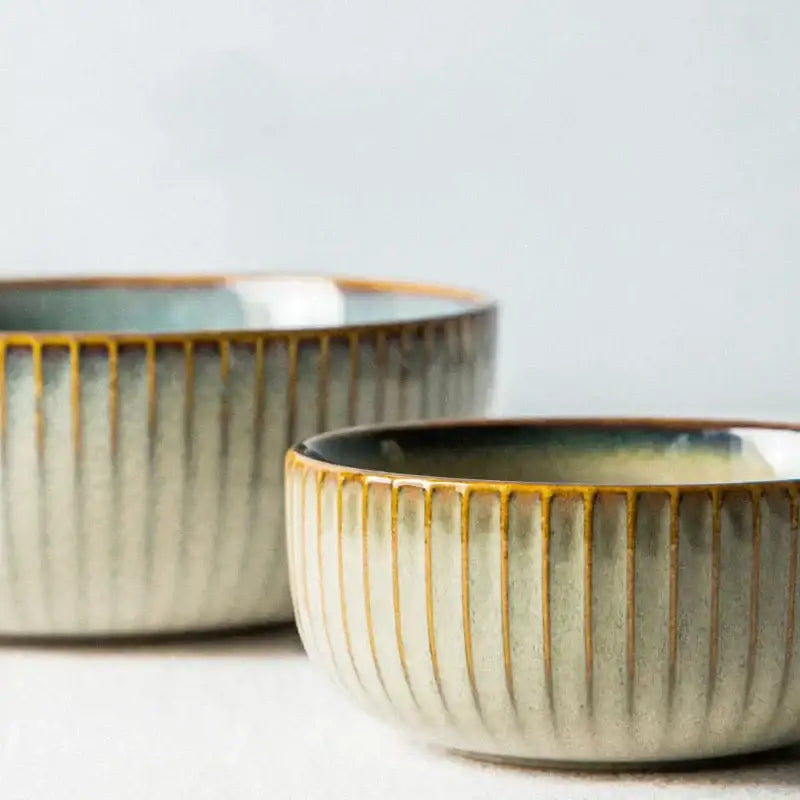 Two handcrafted decorbites ceramic dessert plates with ridge texture and sage to cream gradient glaze with gold rim accents