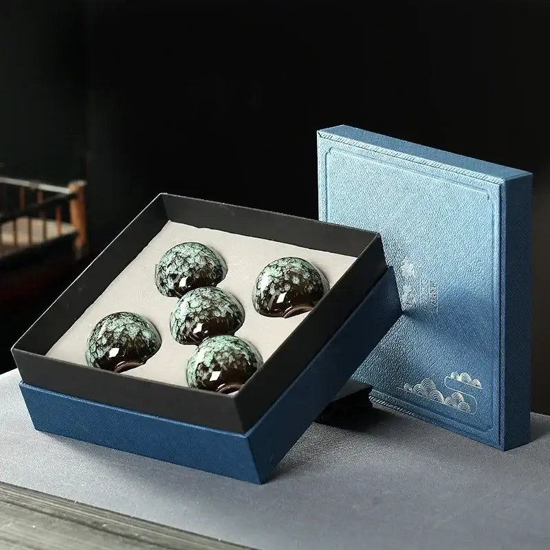 Five glossy dark green ceramic cups with speckled glaze in a blue gift box for decorbites ceramic cups set