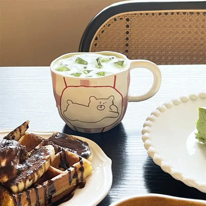Handcrafted white ceramic bear mug with pink and red striped pattern for kitchen coffee use