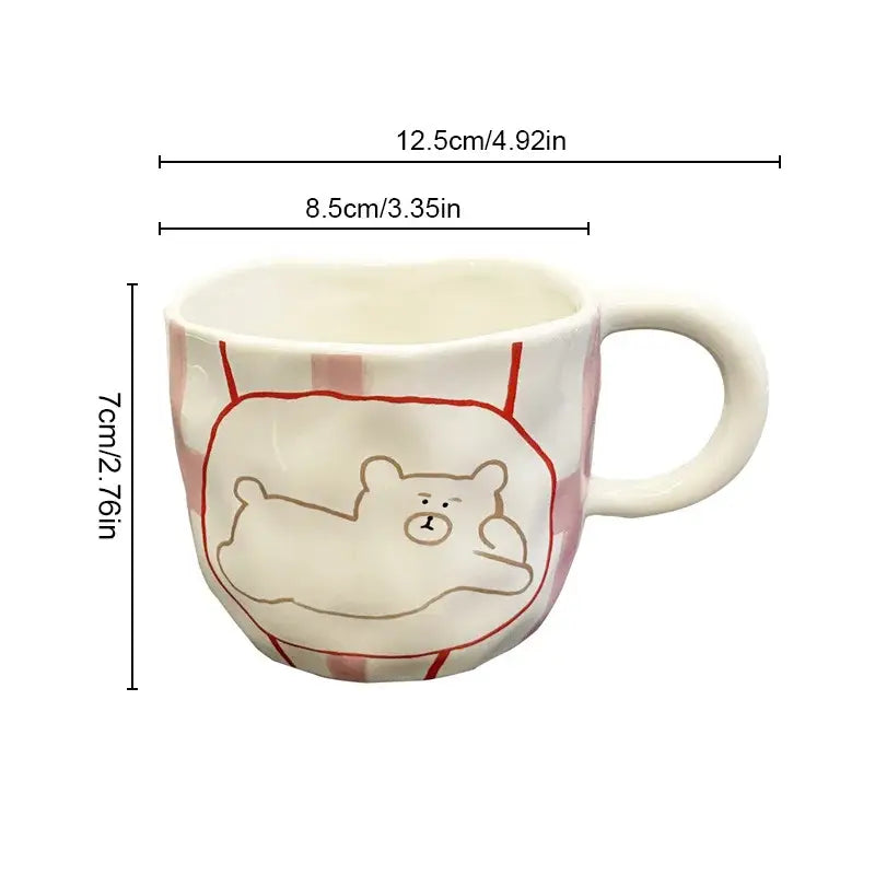 Handcrafted white ceramic bear mug with red and white checkered pattern and brown bear design for kitchen coffee use