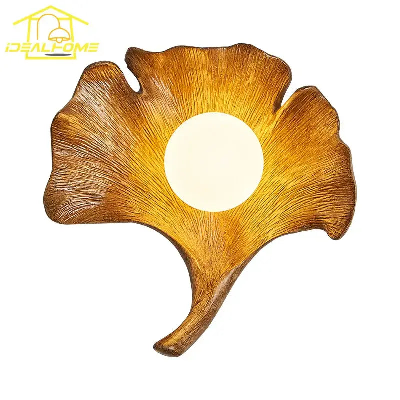 Golden handcrafted wooden ginkgo biloba resin wall lamp with textured leaf design and central light for bedroom decorbites wall lamp