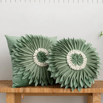 Two sage green velvet cushion covers with decorbites 3d chrysanthemum flower design featuring layered petals and white centers