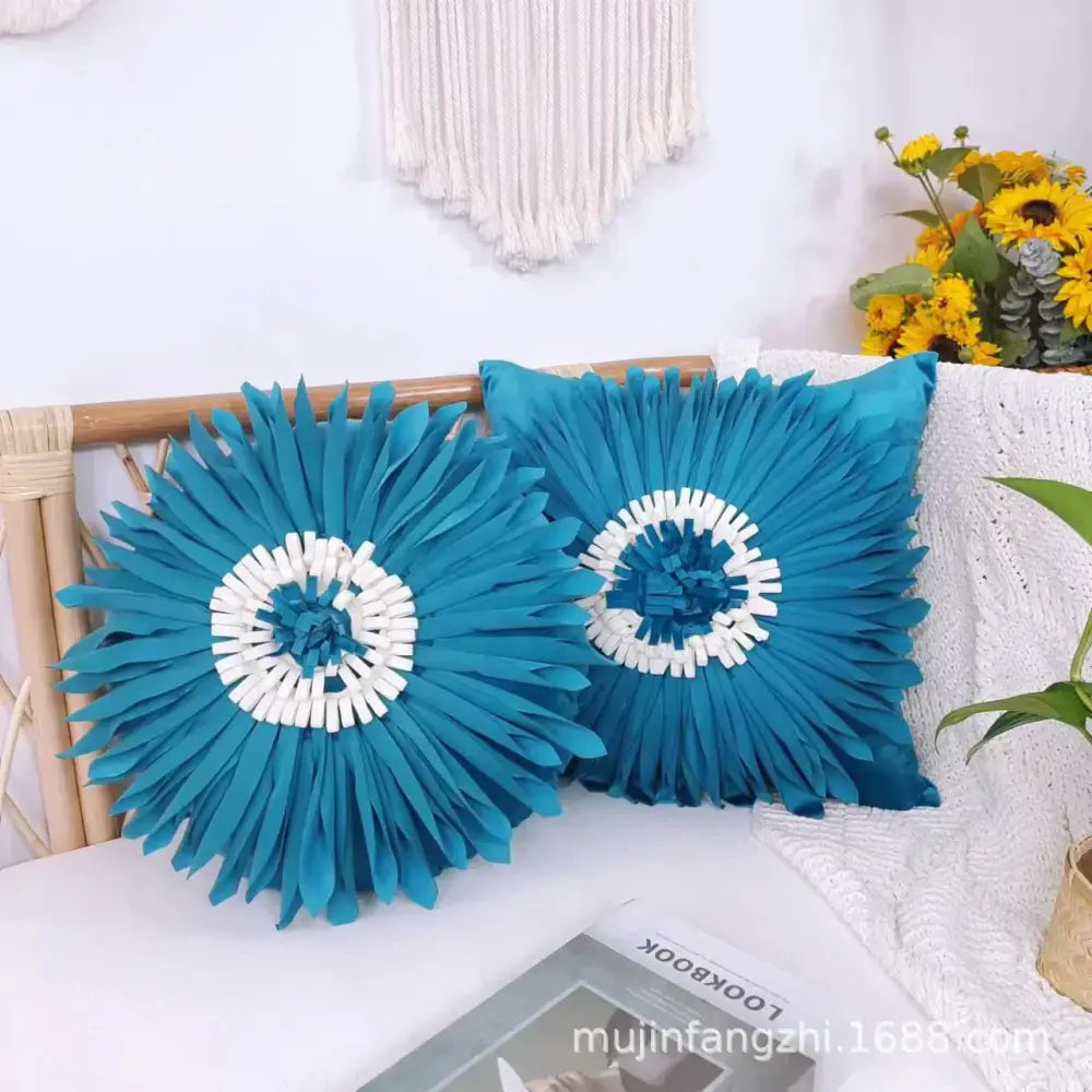 Two vibrant teal handmade decorbites 3d chrysanthemum flower cushion covers with sunburst fabric petals and white center