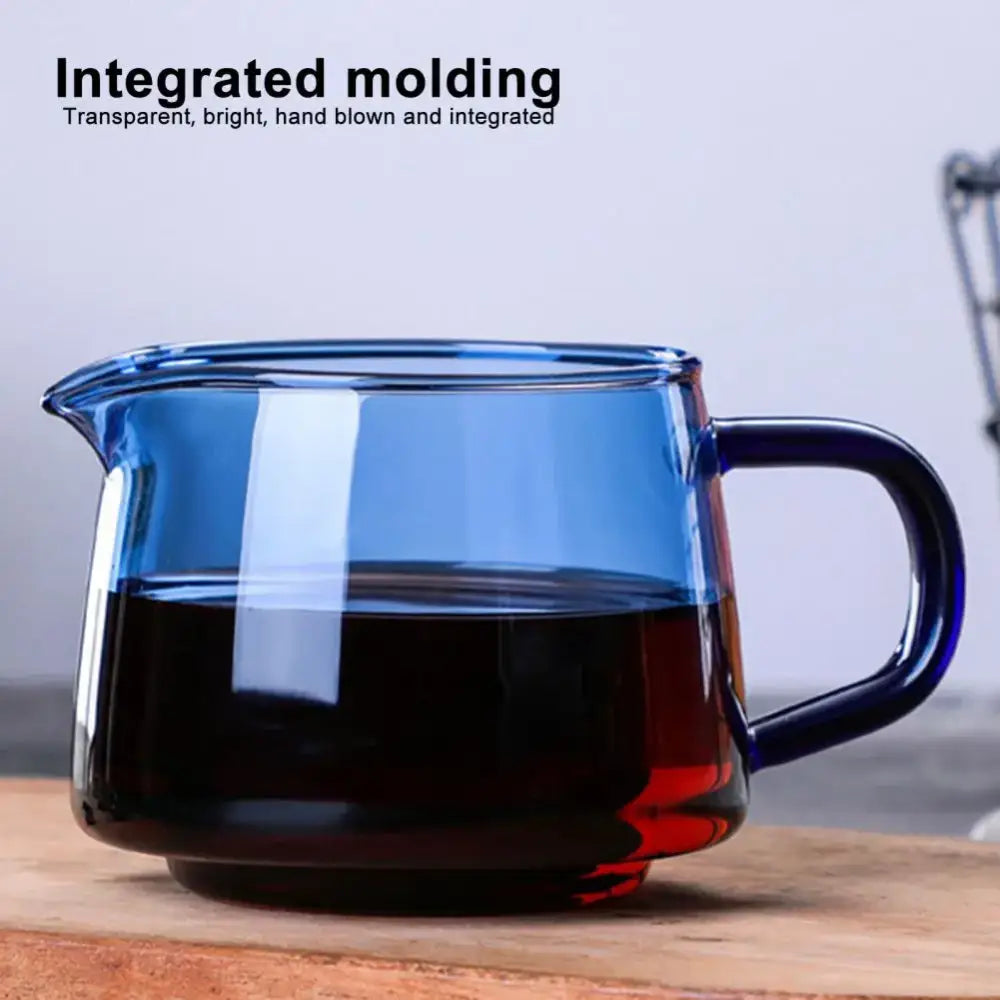 Handmade blue glass coffee sharing pot with sturdy handle and integrated molding for seamless kitchen brewing server