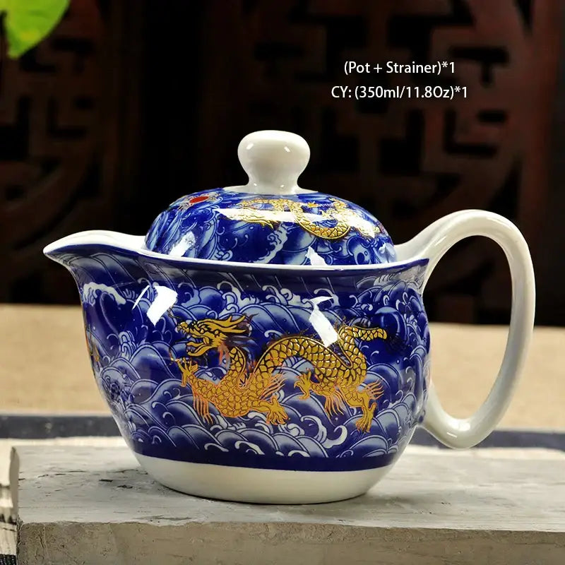 Handmade decorbites ceramic kung fu teapot featuring blue and gold dragon design with white porcelain lid handle and base