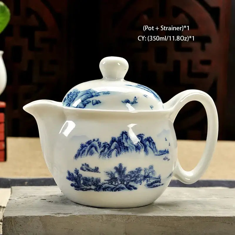 Handmade decorbites ceramic kung fu teapot in white with blue landscape design featuring mountains and trees