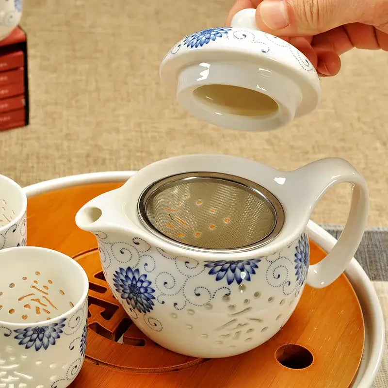 Handmade decorbites ceramic kung fu teapot with blue floral patterns and metal strainer for dragon tea servings