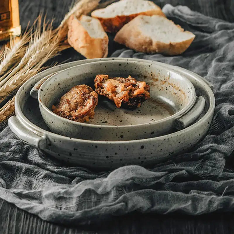 Handmade ceramic sushi plate set in speckled gray featuring a gray speckled serving dish nested in a matching bowl