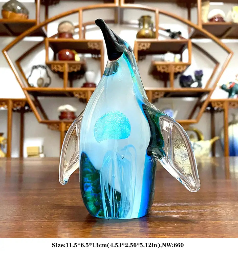 Handmade translucent blue and green glass sika deer figurine with black beak and internal jellyfish design for decor