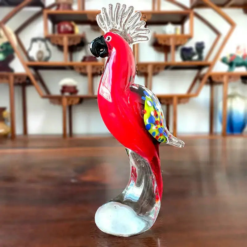 Handmade vibrant red glass sika deer figurine with black beak and iridescent silver crest for living room decor