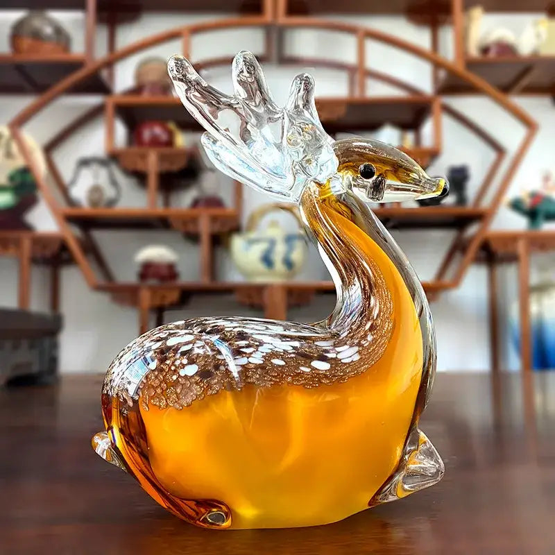 Handmade colorful crystal sika deer figurine in translucent amber glass with detailed antlers and white speckled markings