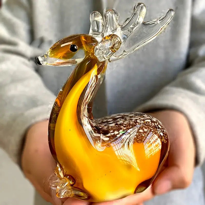 Handmade translucent amber glass sika deer figurine with clear antlers and speckled brown pattern for living room decor