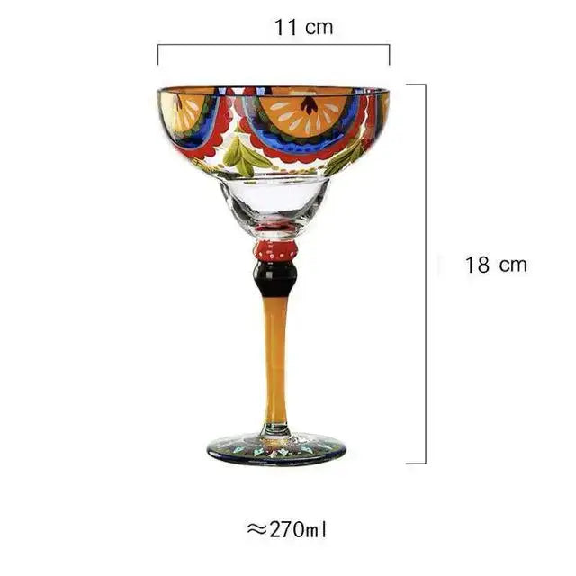 A decorbites handmade colorful margarita glass with vibrant floral and citrus patterns in orange blue red and green