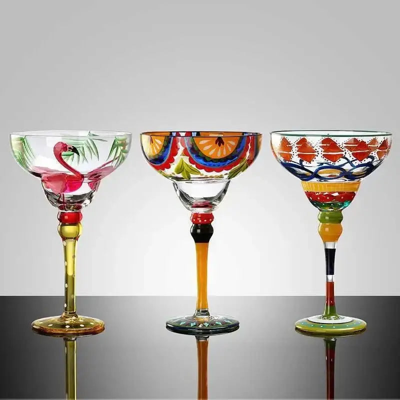 Three decorbites handmade colorful margarita glasses with vibrant painted designs and decorative stems for drinkware