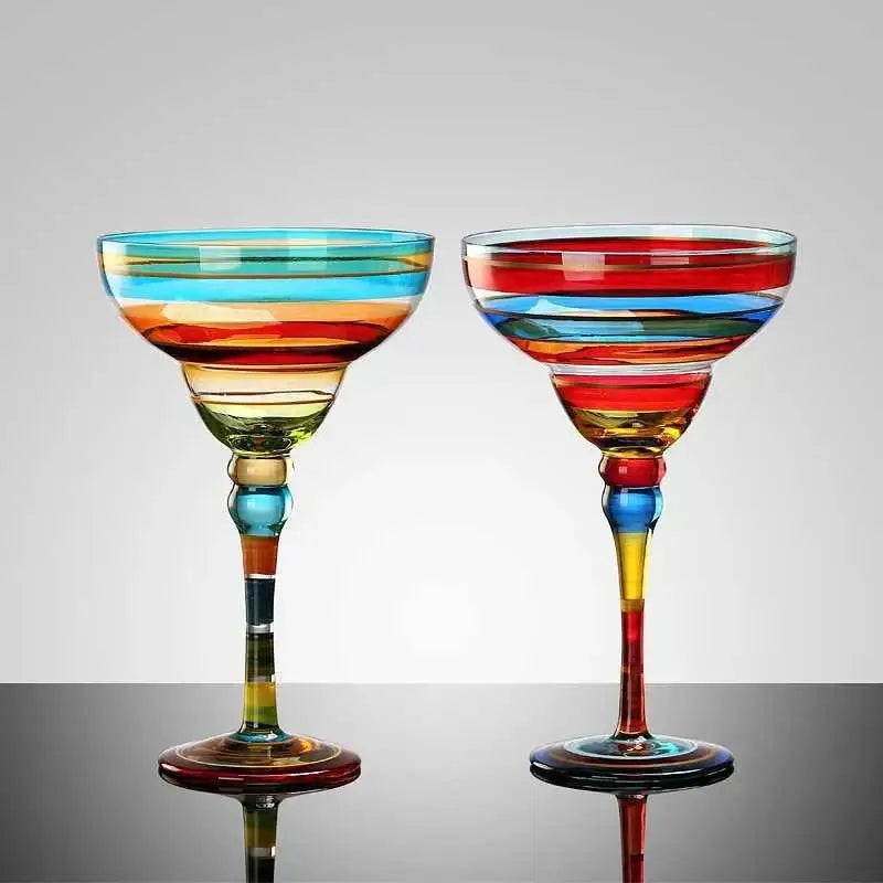 Two decorbites handmade colorful margarita glasses with vibrant red blue yellow and green horizontal stripes for dining room drinkware