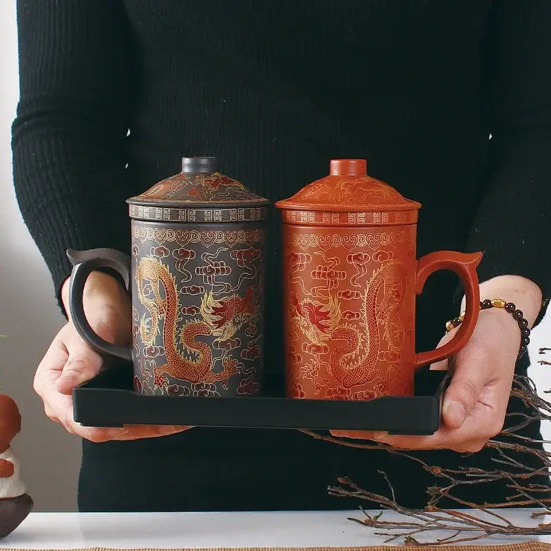Handmade dragon purple clay tea mug set with dark gray and terracotta orange mugs featuring gold dragon design