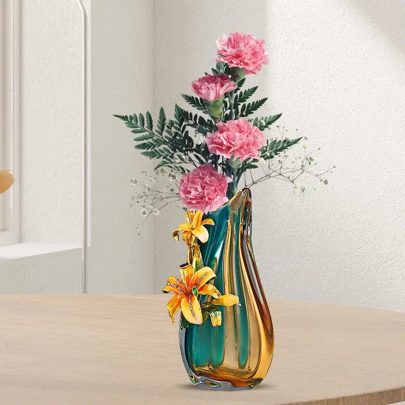 A sleek decorbites handmade enamel vase in teal and amber with golden lily embellishments for living room decor