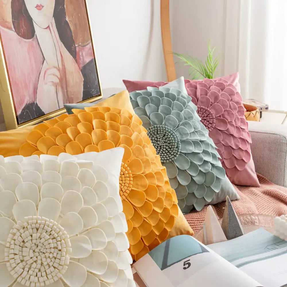A set of decorbites handmade flower cushion covers with layered petal design in pastel yellow mint green dusty rose and cream