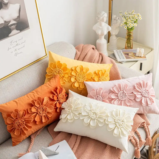 Set of four decorbites handmade flower cushion covers in vibrant orange yellow pink and white with 3d floral appliqués