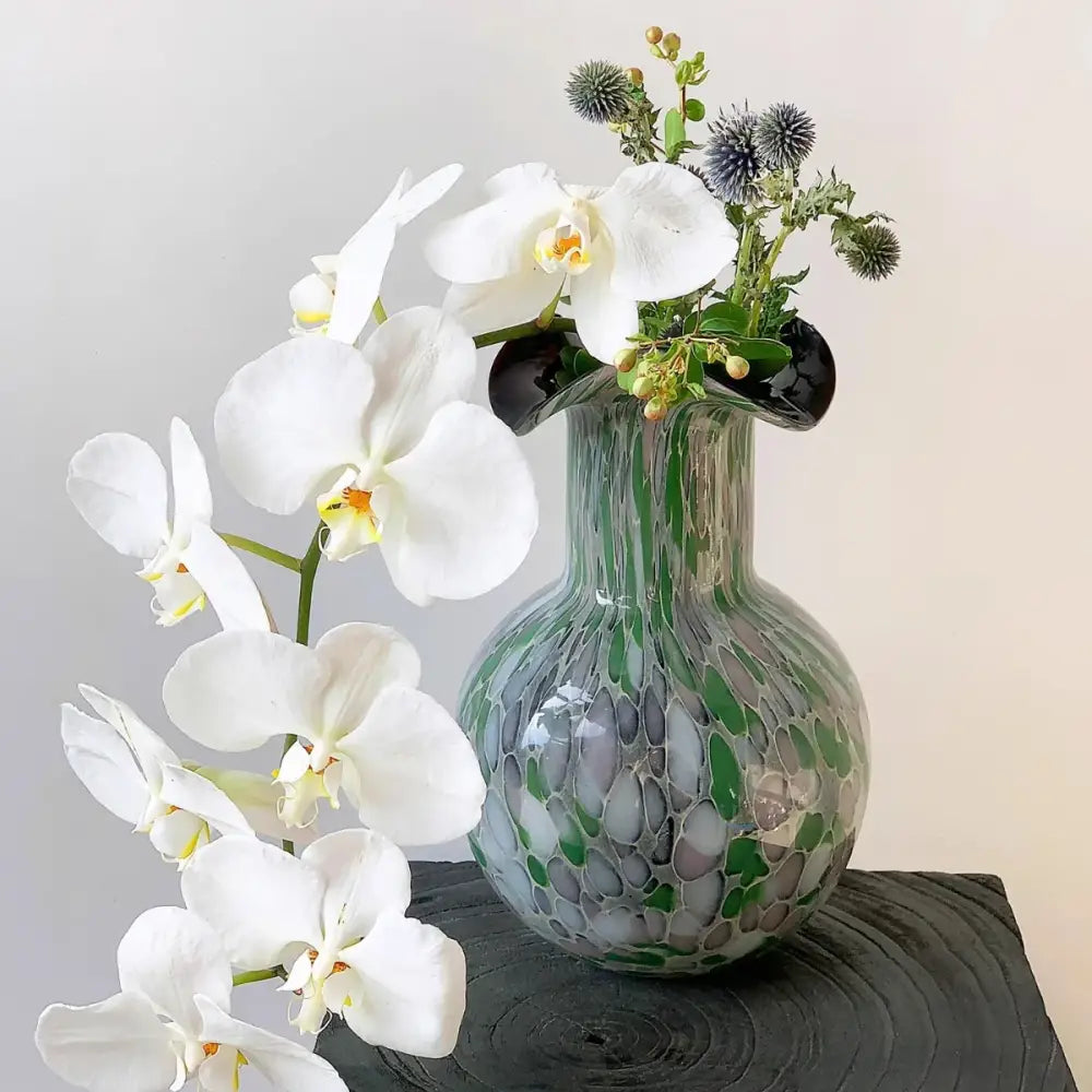 Handmade glass vase pebble in emerald and silver swirling decorbites handmade glass holding white orchids and thistle flowers