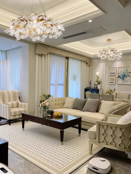 Handmade gold glass crystal led branches chandelier with gold-toned accents hanging in a dining room ceiling light