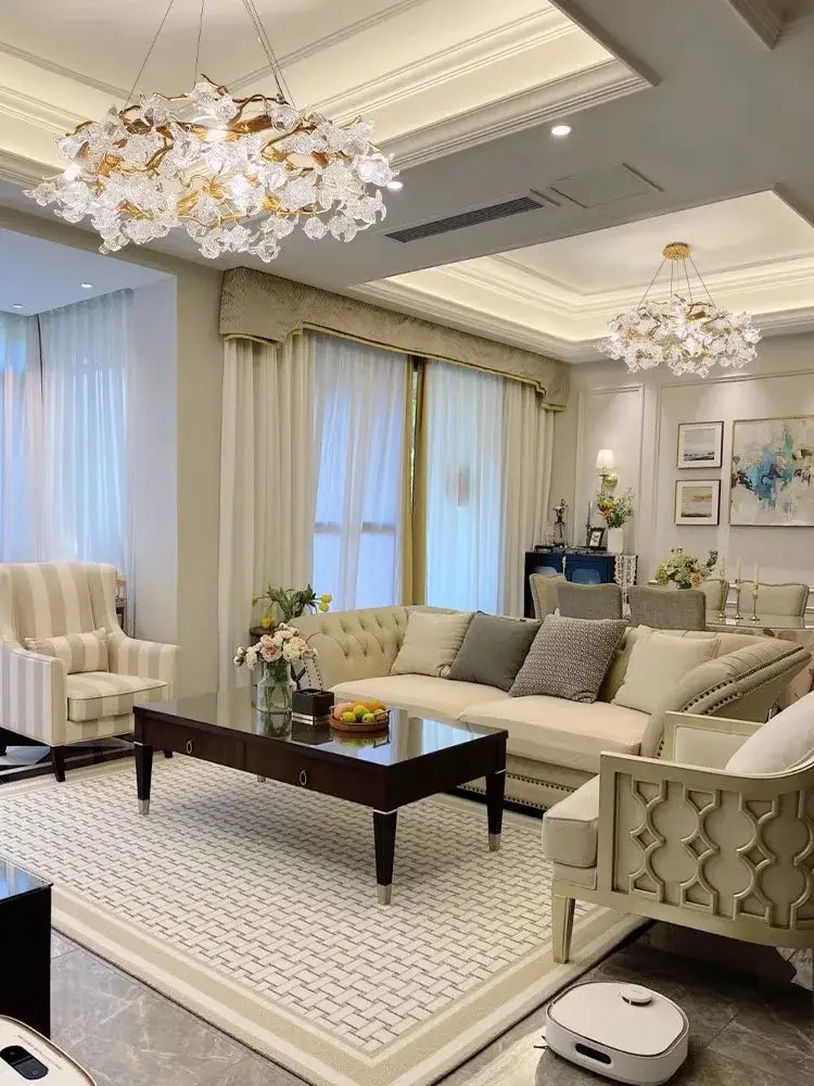 Handmade gold glass crystal led branches chandelier with gold-toned accents hanging in a dining room ceiling light