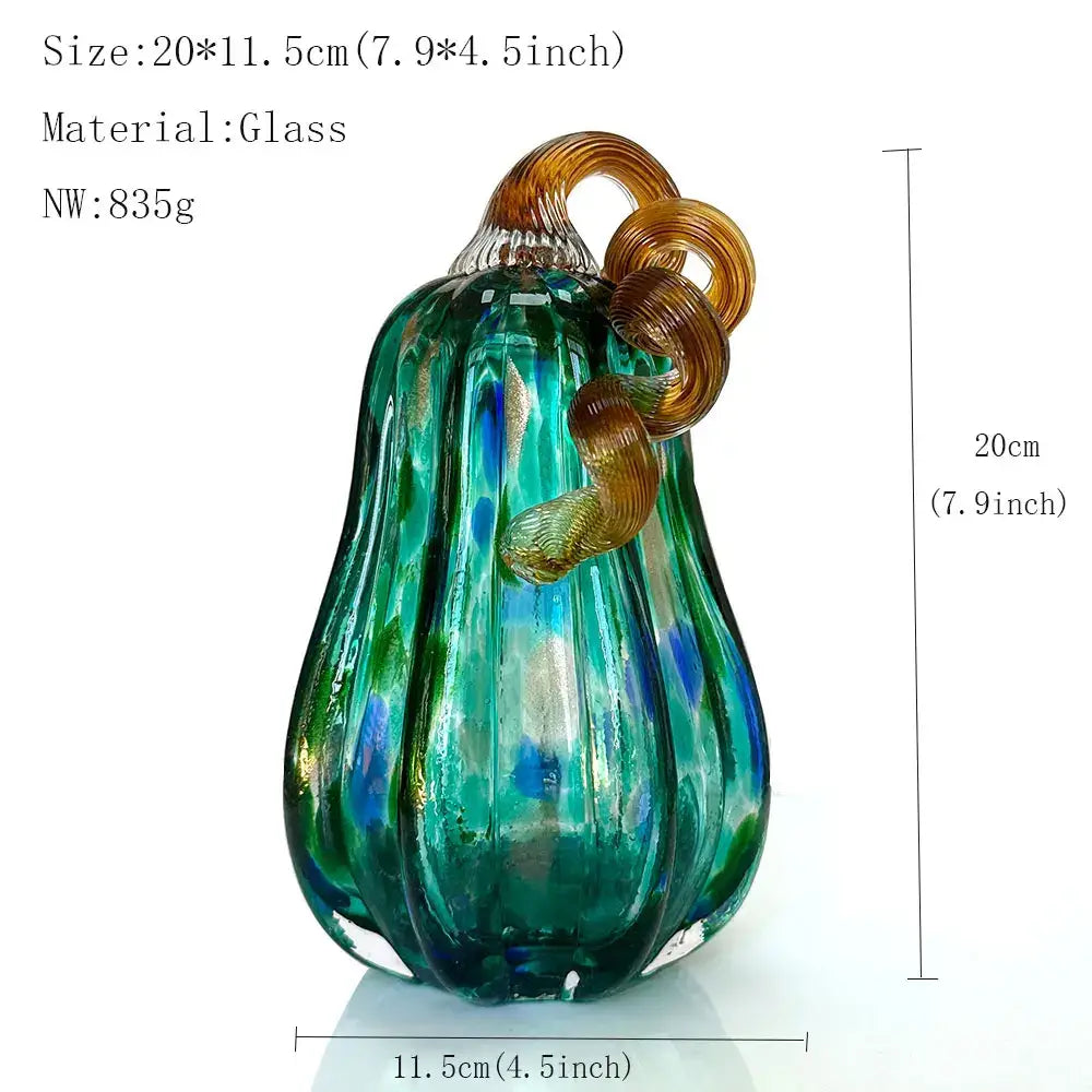 Handmade iridescent teal and green glass pumpkin figurines with a translucent twisted amber stem for living room decor