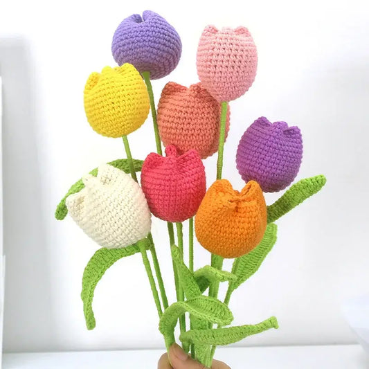 A colorful bouquet of decorbites handmade knitted crochet tulips in vibrant hues for bedroom flower decor
