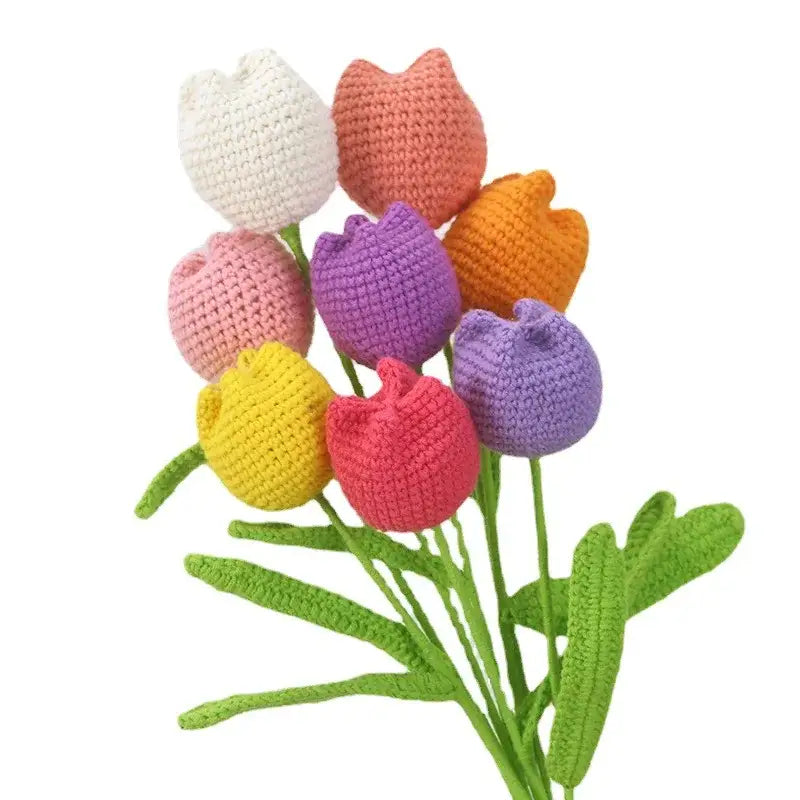 A colorful handmade knitted crochet tulips bouquet in white peach pink purple yellow and orange for bedroom decor