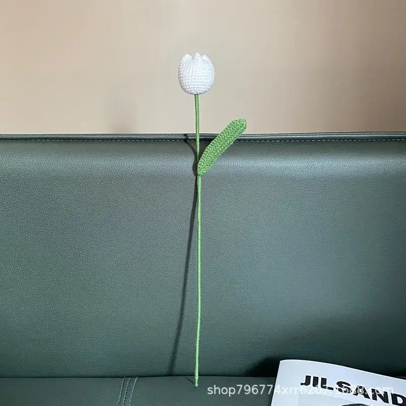 Handmade knitted crochet white tulip with green stem and leaf featuring textured yarn for bedroom flower decorbites handmade knitted decor