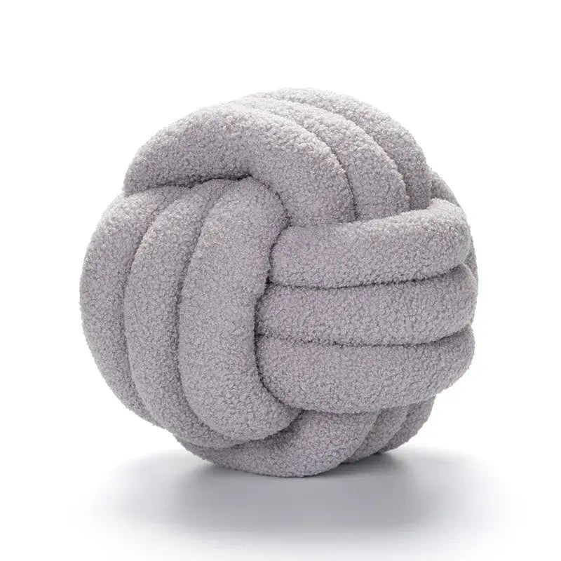 Handmade soft light gray knotted boucle circle plush pillow made of textured fleece for bedroom decor