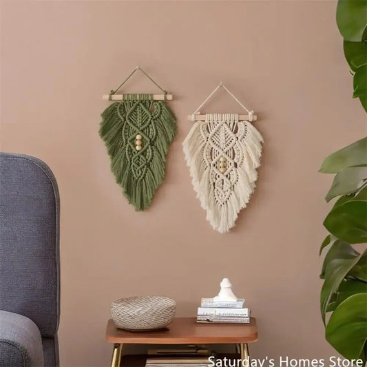 Handmade macrame leaf wall hangings in olive green and off-white with intricate patterns and wooden beads for bedroom decor