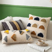Cream pillow cover with textured colorful geometric tufted patterns in mustard yellow navy and gray decorbites handmade moroccan