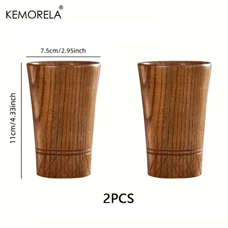 Two handmade natural wooden tea tumblers with warm brown finish and subtle engraved diamond patterns by decorbites