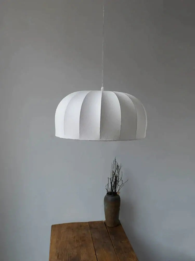 White pleated paper pendant light with minimalist dome shape for dining room featuring silk pendant lamps design