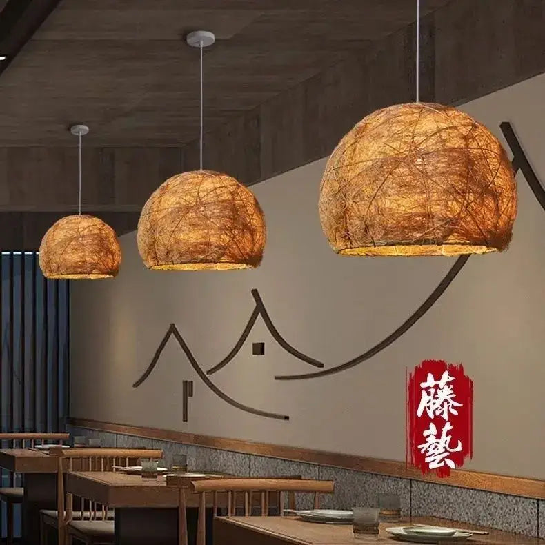 Warm-toned spherical pendant lamp with woven natural fiber shades made of handmade rattan bamboo for living room decorbites