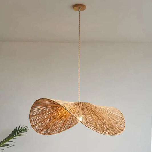 A warm-toned handmade rattan rope vertigo pendant lamp with a twisted woven design for dining room decorbites decor