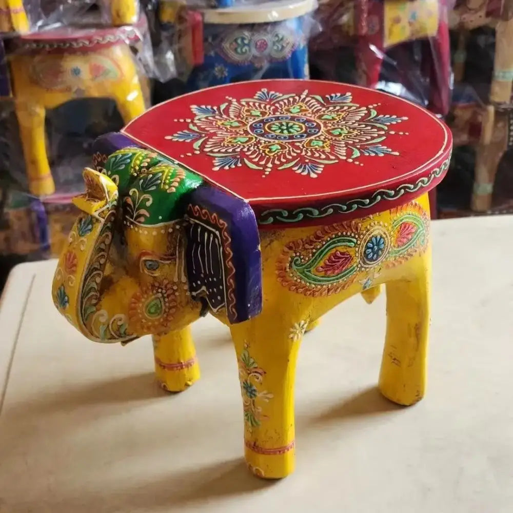 Handmade thai style vibrant yellow decorbites elephant stool with red painted top and colorful decorative patterns for living room decor