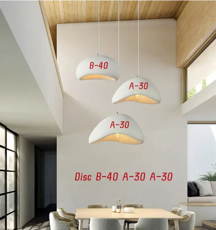 Three handmade wabi sabi white ceramic pendant lights with red lettering and warm lighting for dining room decorbites wabi sabi chandelier