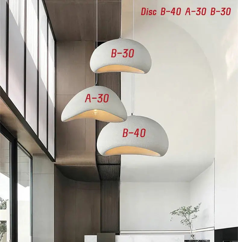 Modern white disc handmade wabi sabi chandelier with red labels hanging in minimalist dining room decorbites handmade wabi