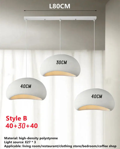 Modern minimalist handmade wabi sabi chandelier white trio pendant light in matte polystyrene with warm interior glow and labeled dimensions