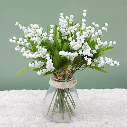 A clear glass vase with rope neck holds white bellflower artificial flowers decorbites bellflower artificial bouquet